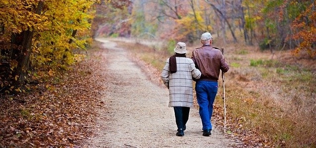elderly couple walking social security