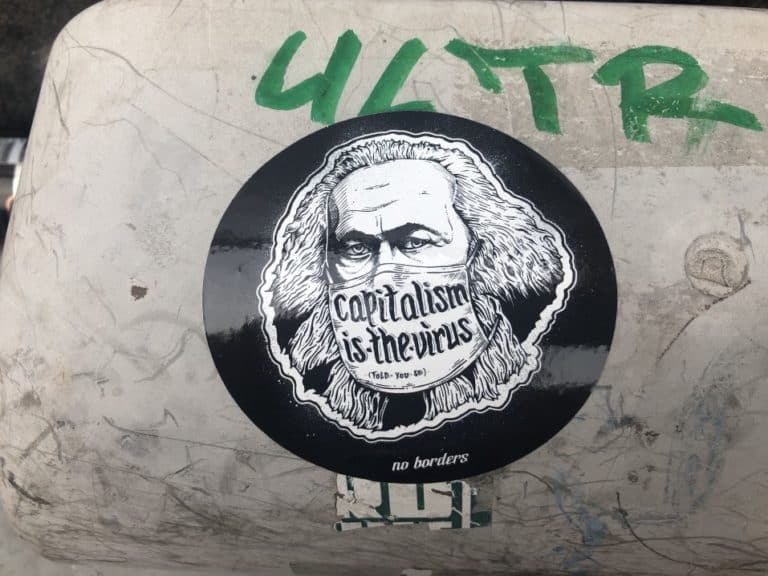 Sticker saying "Capitalism is a virus"