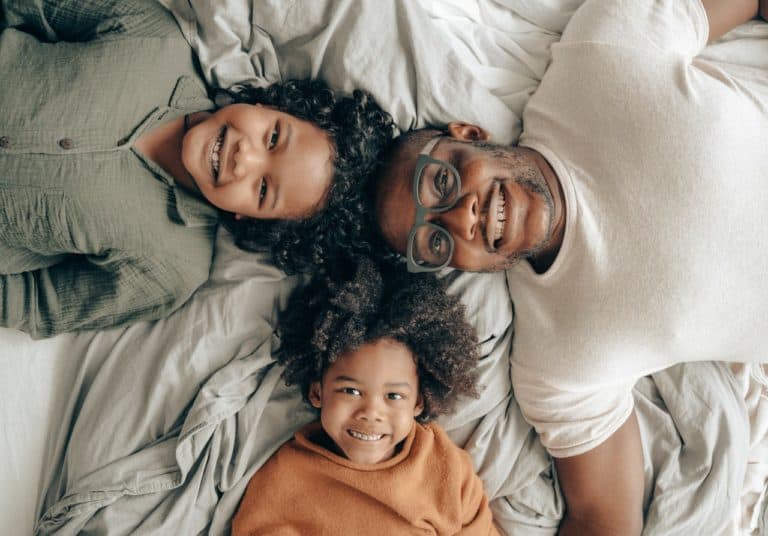 Picture of a black family in bed